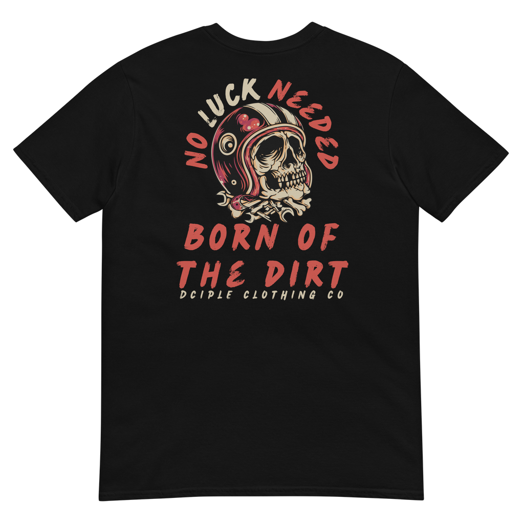 Vintage skull wearing a retro racing helmet with No Luck Needed Born of the Dirt graphic on a forest green T-shirt.