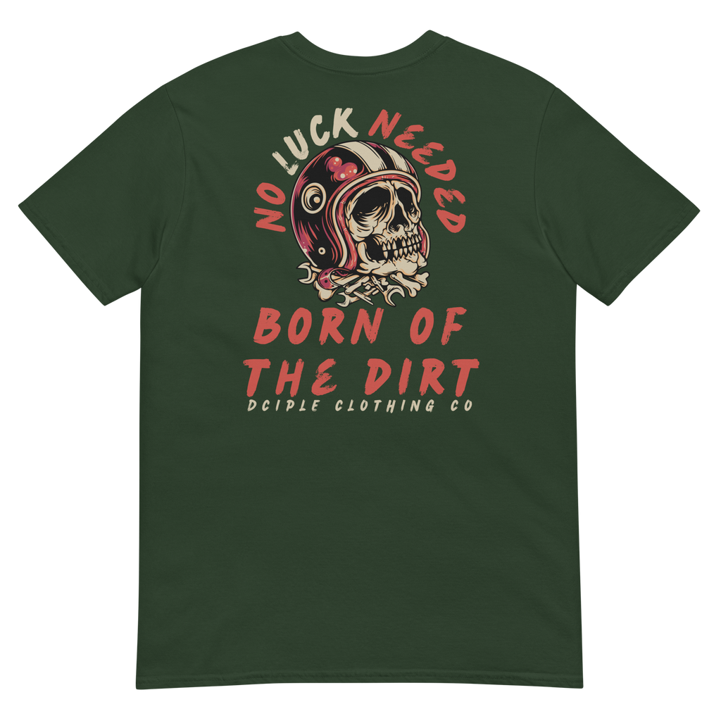 Vintage skull wearing a retro racing helmet with No Luck Needed Born of the Dirt graphic on a forest green T-shirt.